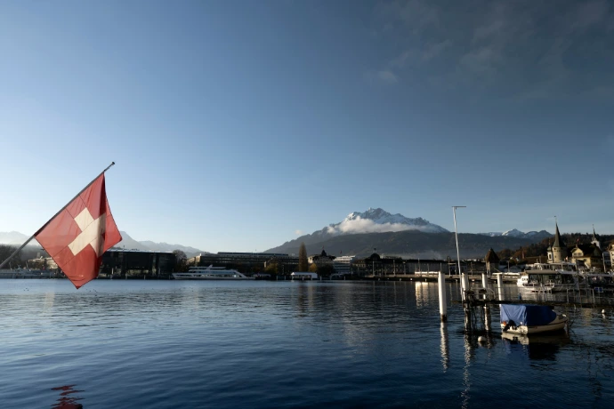 Swiss flag with mountain and lake landscape